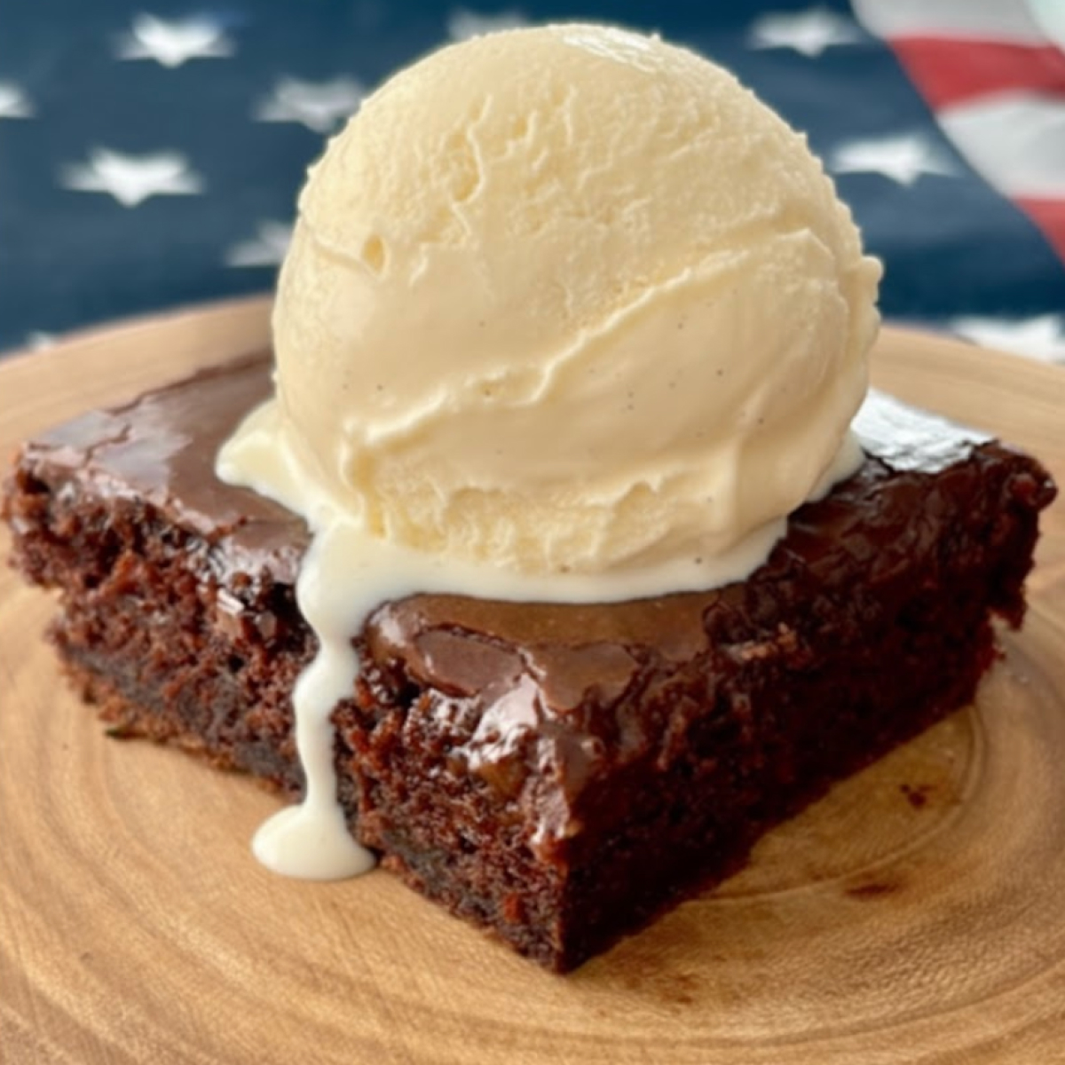 A slice of decadent fudge zucchini cake with a thick layer of chocolate frosting.
