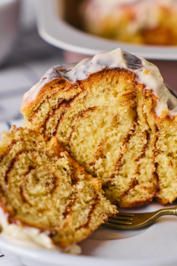 Close-up of sliced cinnamon swirl bread showing soft interior with thick brown sugar cinnamon ribbon baked throughout.