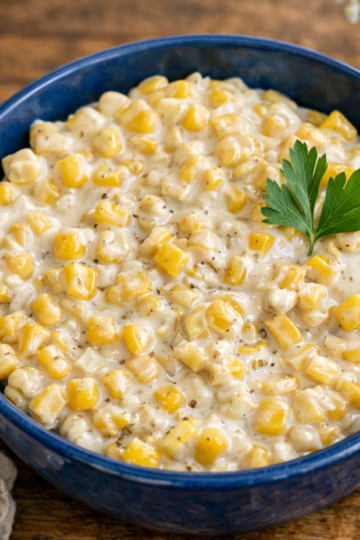 Honey Butter Skillet Corn — creamy buttered corn glazed with honey, topped with chopped parsley.
