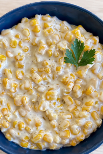 Honey Butter Skillet Corn — creamy buttered corn glazed with honey, topped with chopped parsley.