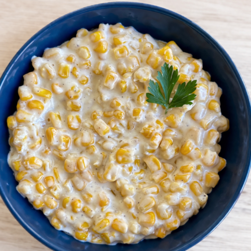 Honey Butter Skillet Corn — creamy buttered corn glazed with honey, topped with chopped parsley.