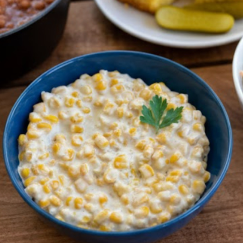 Honey Butter Skillet Corn — creamy buttered corn glazed with honey, topped with chopped parsley.