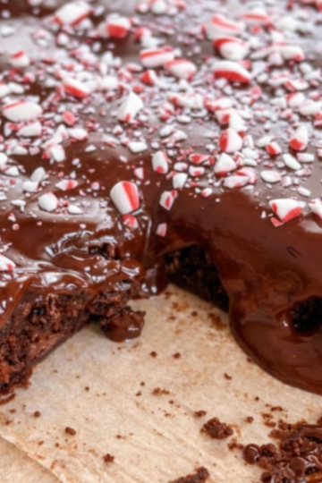 Fudgy peppermint hot chocolate brownies topped with silky chocolate ganache and crushed candy canes.