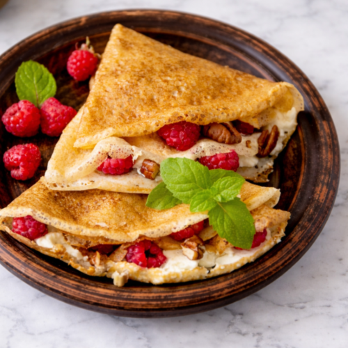 Sourdough crepes filled with fresh colorful fruit and fluffy cream.