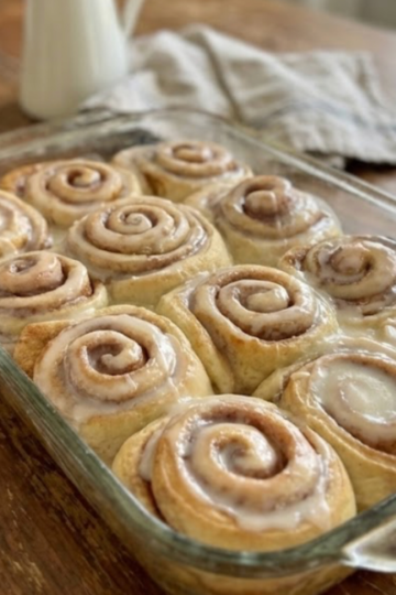 Old fashioned sourdough discard cinnamon rolls baked until soft and fluffy, swirled with cinnamon sugar and topped with a generous vanilla glaze.