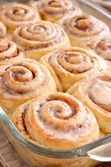 Old fashioned sourdough discard cinnamon rolls baked until soft and fluffy, swirled with cinnamon sugar and topped with a generous vanilla glaze.