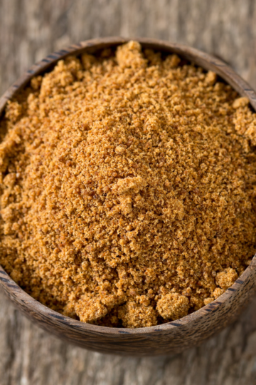 Homemade garam masala made with ground spices, mixed together in a small bowl.