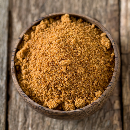 Homemade garam masala made with ground spices, mixed together in a small bowl.
