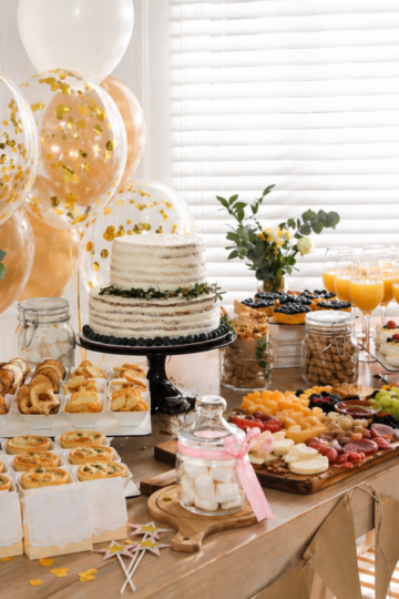 A bridal shower food table showing how much food per person for appetizers, meals, desserts, and drinks.
